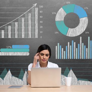 Woman analyzing data charts on a laptop with various graphs in the background.