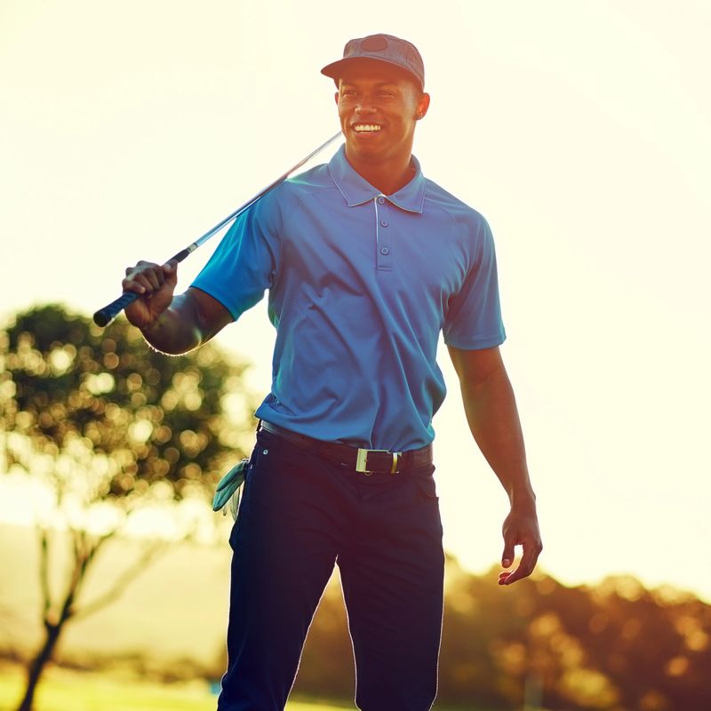 Shot of a young man playing golf