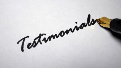 Fountain pen writing the word 'Testimonials'.