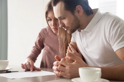 Engaged couple reviewing a prenuptial agreement in Arizona