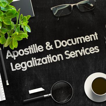 Workspace with text 'Apostille & Document Legalization Services' on blackboard.