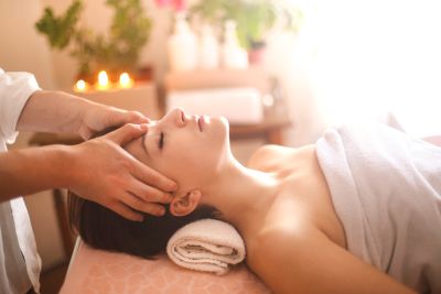 Woman receiving a relaxing head massage.