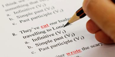 A person answering a multiple choice test in English in pencil