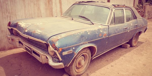 Junk old car at the salvage yard