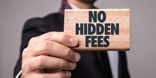 man standing with a piece that says no hidden fees