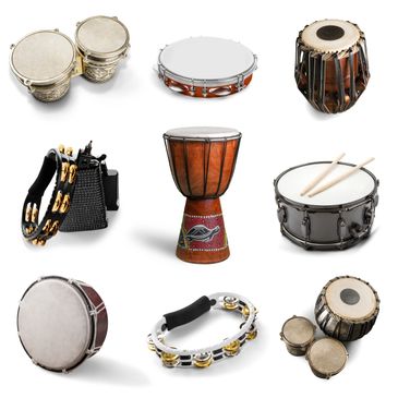 Various hand percussion instruments including drums, tambourines, and bongos arranged in a grid.
