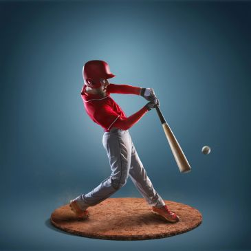 Baseball player swinging bat to hit ball.