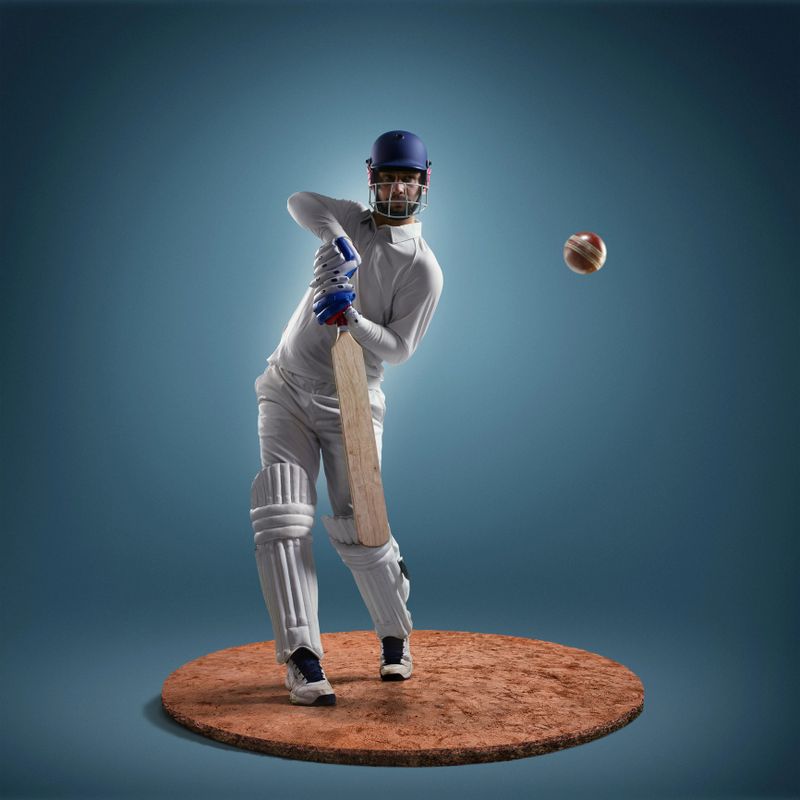 Game moment from cricket. The action takes place on a small round island covered with sand. Sportsman wears unbranded sport clothes
