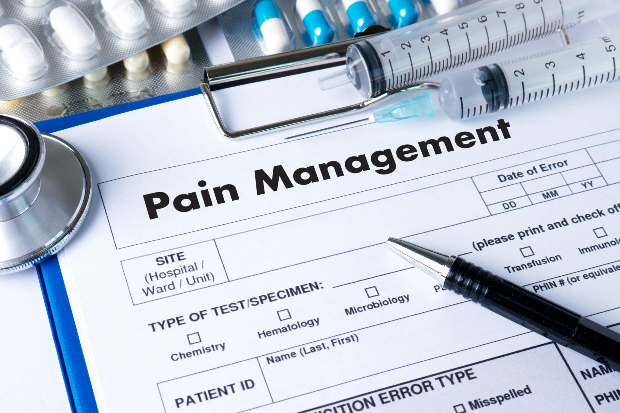 Pain management form with medical tools.