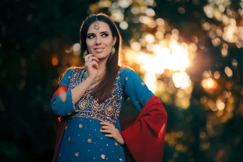 Beautiful girl wearing a salwar kameez with matching earrings, mangtika and necklace