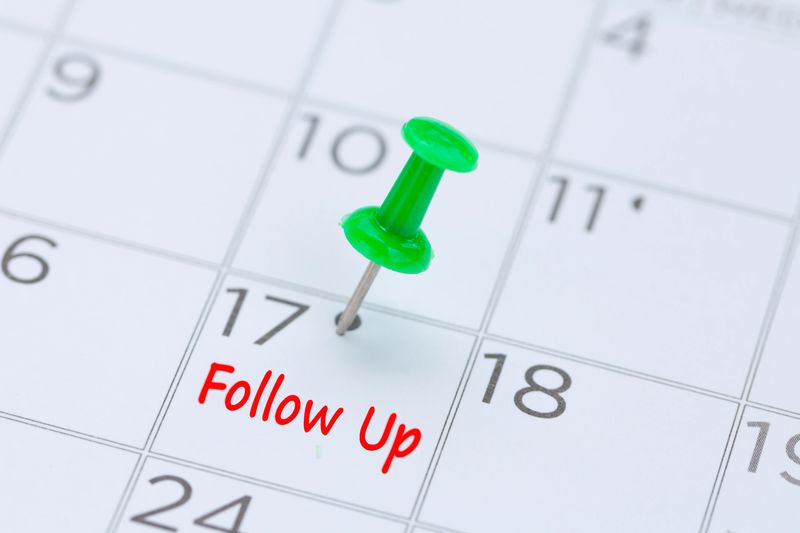 Professional following up with a team member to review next steps and outcomes
