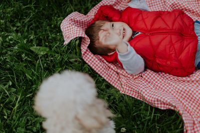 Cute illustration of a child with a quilt and a puppy for kids.
