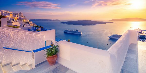 Cruise ship in the Santorini, Greece at sunset
