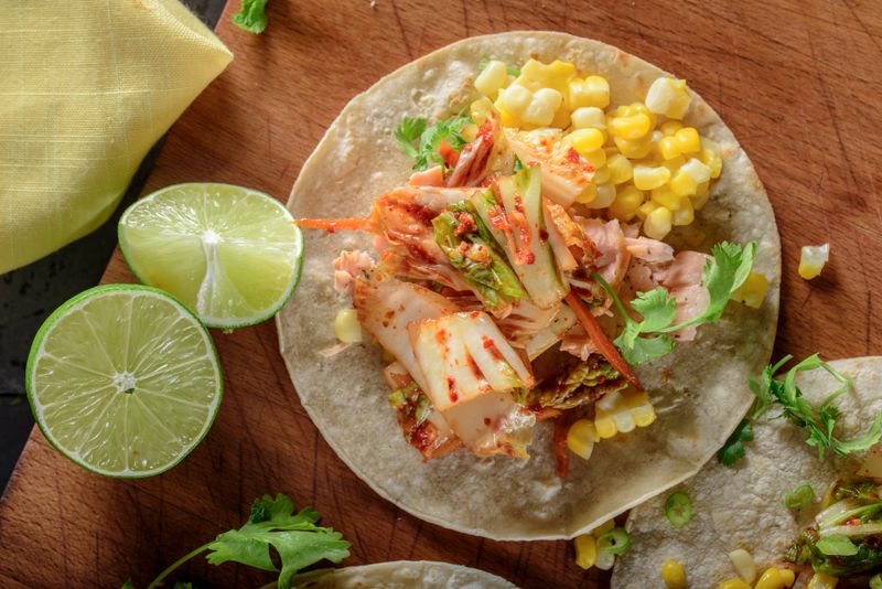White corn tortilla with kimchee and grilled salmon