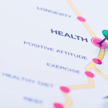 Pushpin marks the word HEALTH on a paper with health-related terms.