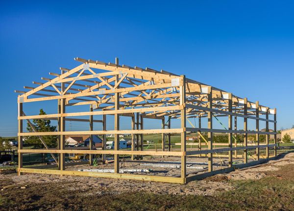 Stock photo Exterior view of a pole shed frame with wood