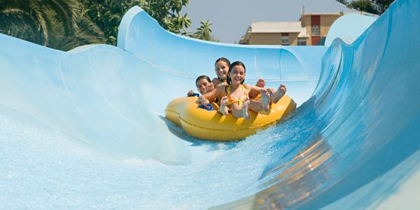 Family having fun on a water slide.