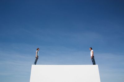 Two people leaning towards each other represents the innate need for secure and healthy attachment. 