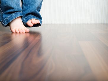 Child walking on Engineered Wood