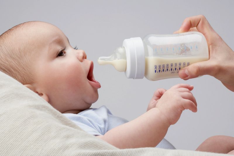 A baby being fed a bottle