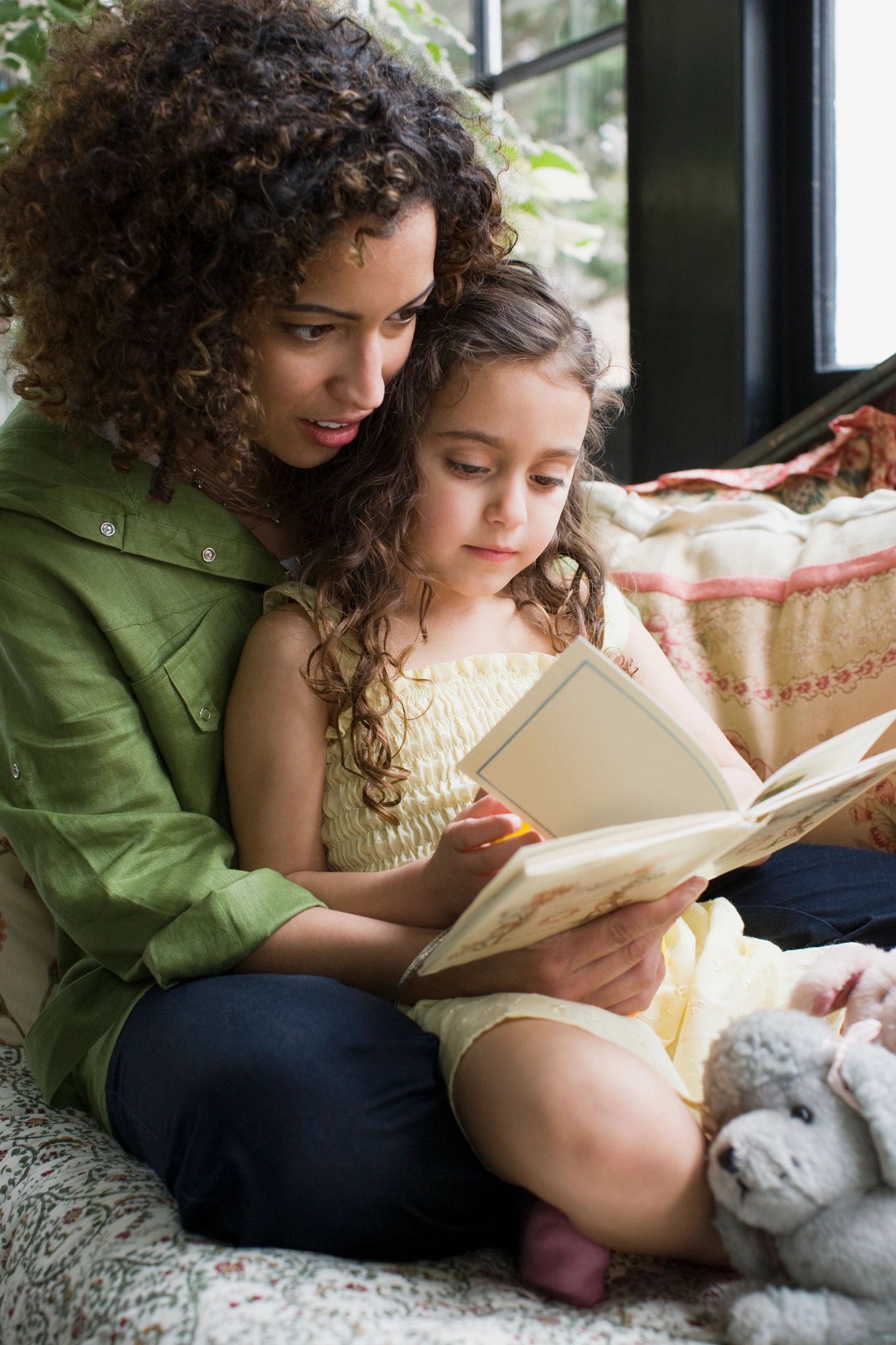 A mother and daughter reading together, showcasing children's books.