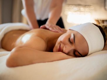 Woman enjoying a relaxing back massage.