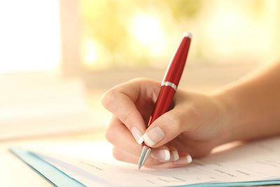 Writing a testimony or review after holistic wellness appointment at functional body therapies. 