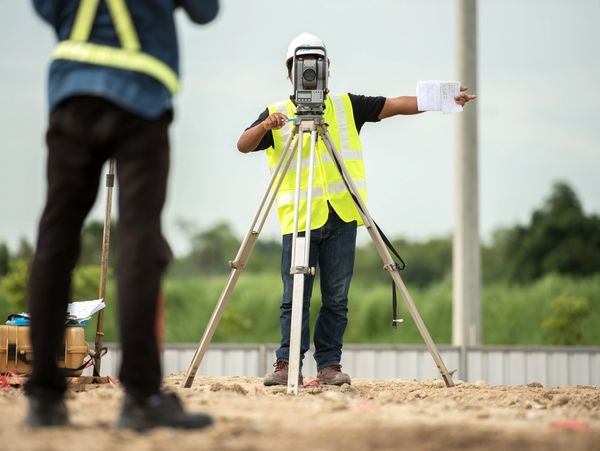 Surveyors on a construction site.