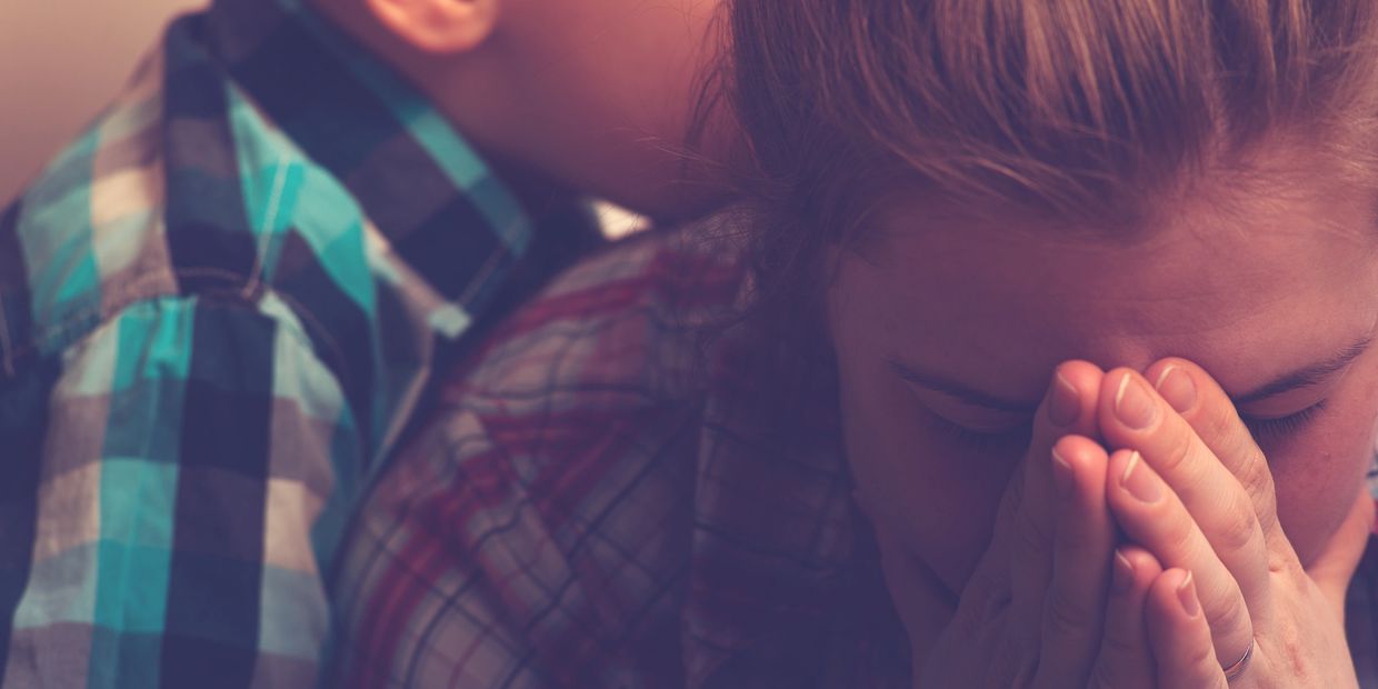 two children visually upset and crying who appear to have received upsetting news