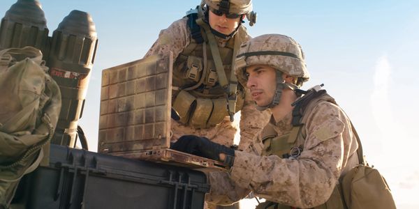 Marines looking at laptop