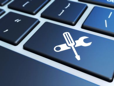 Keyboard key with screwdriver and wrench icon.