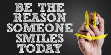 Motivational message with hand drawing a smiley.