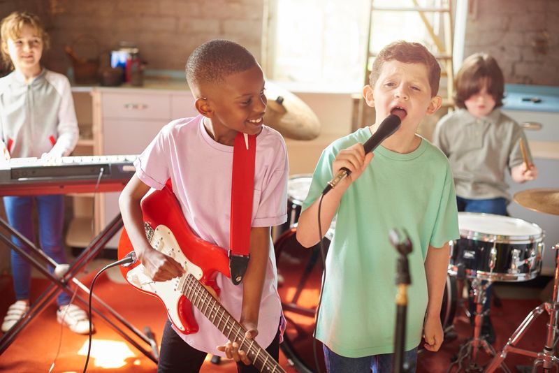 a group of youngsters rock out in the garage