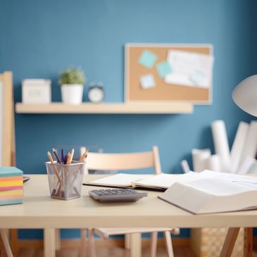 A tidy study desk with books, stationery and an organised learning setup.
