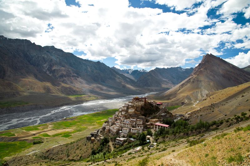 Key monastery and Himalayan mountain against cloudy sky