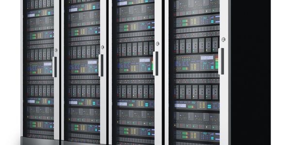 A row of server racks with multiple networked devices inside.
