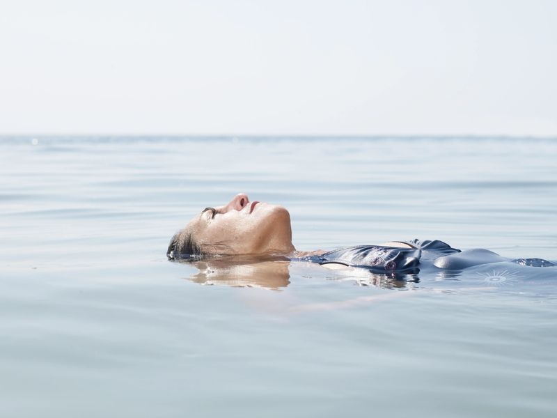 Woman floats in the water