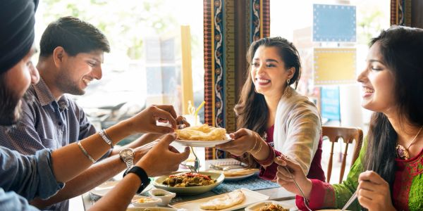 Group of friends enjoying food at a restaurant.