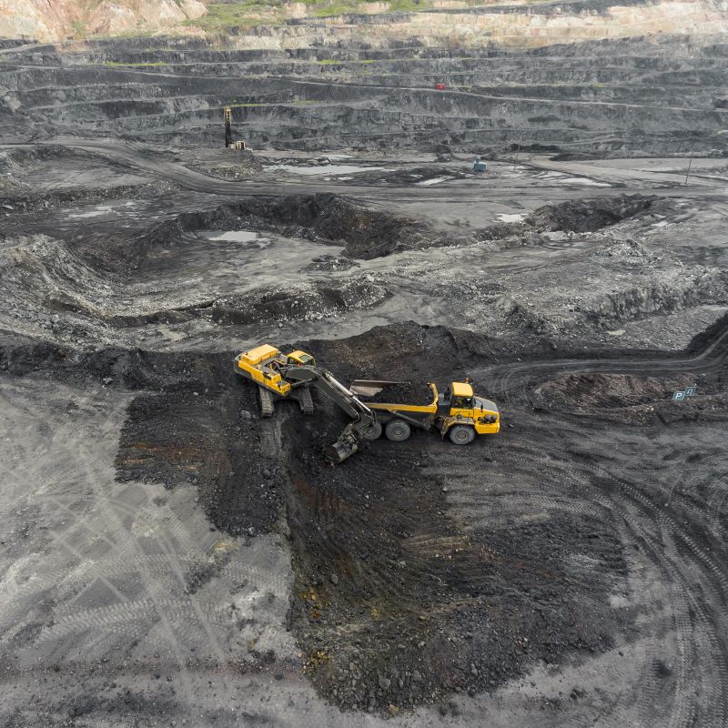 Aerial view open pit mine, loading of rock, mining coal, extractive industry anthracite