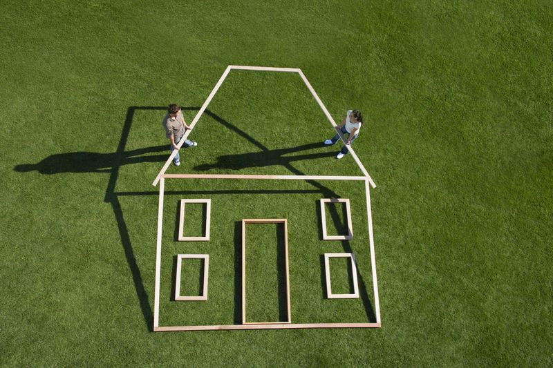 Couple building house outline