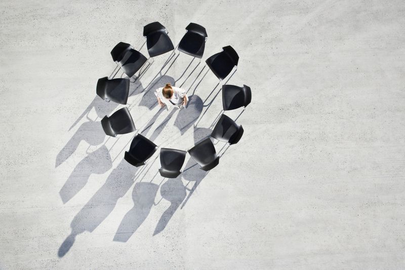 A team of multiethnic developers is meeting to review the data analysis of marketing from social media platforms.