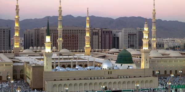 The illuminated Al-Masjid an-Nabawi mosque at dusk in Medina, Saudi Arabia. Reverts Umrah is here to guide reverts and converts during their Umrah trips. 