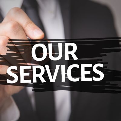 A guy in a suit writing our services in marker 