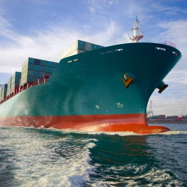 Large container ship sailing on the water.