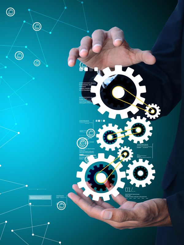Businessman interacting with digital gears symbolizing technology and innovation.