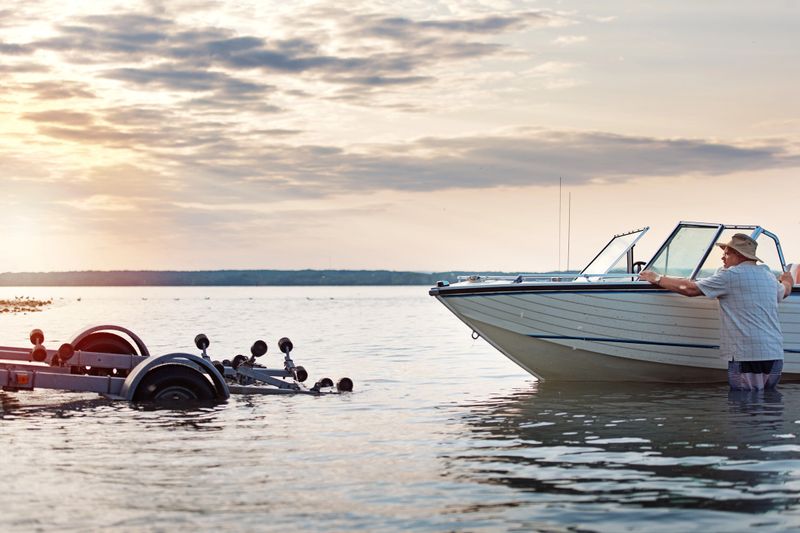 Week-ed activities between senior brothers.  Stacking boat and lashing it onto a trailer