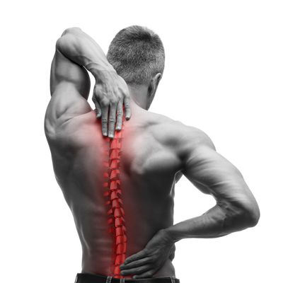 Man holding his back with highlighted spine indicating pain or injury.