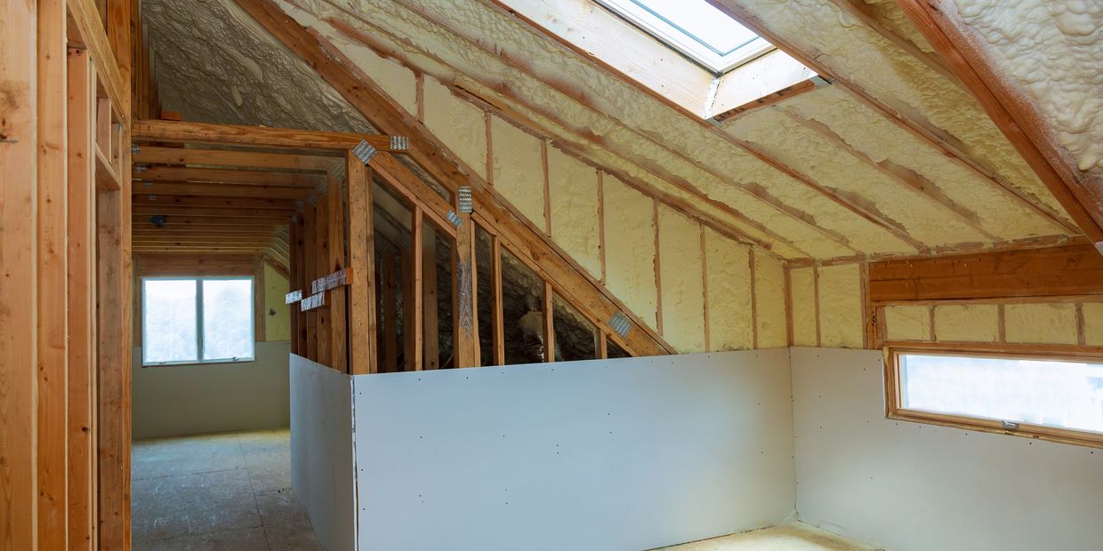 Wall Board sheetrock plaster dry wall over insulated spray foam attic walls and ceiling in Boston MA