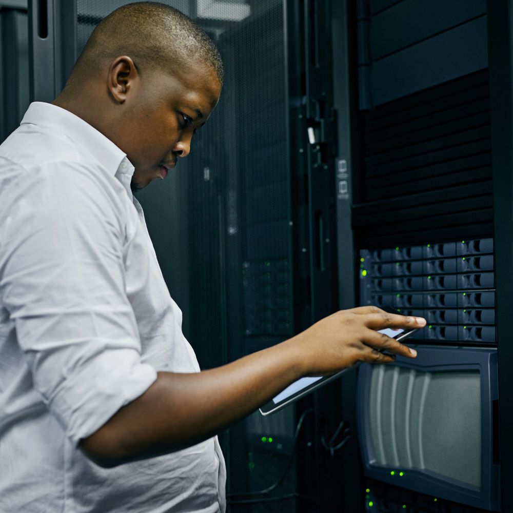 IT professional managing server hardware in a data center.