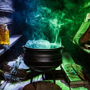 Cauldron with green smoke in a mystical setting.